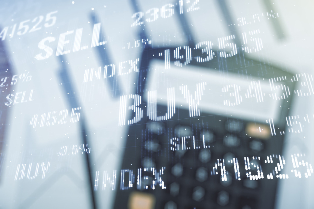 Multi-exposure image featuring virtual 'BUY' and 'SELL' financial charts overlaying a blurred calculator, symbolizing market analysis, trading, and financial decision-making.